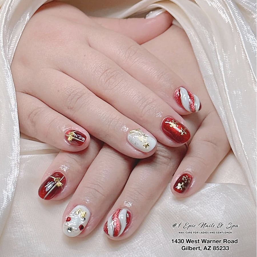 Short red and white holiday nail art with gold accents