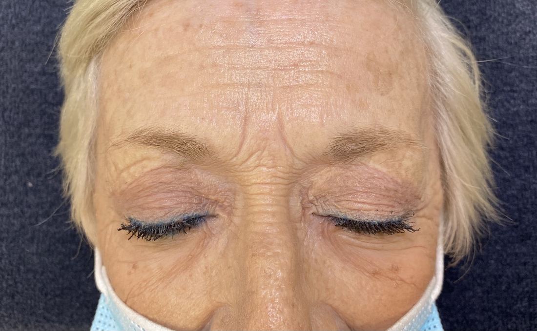 Soft, full brows on a client with silver hair
