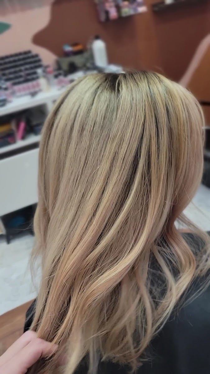 Blended golden blonde with a soft shadow root