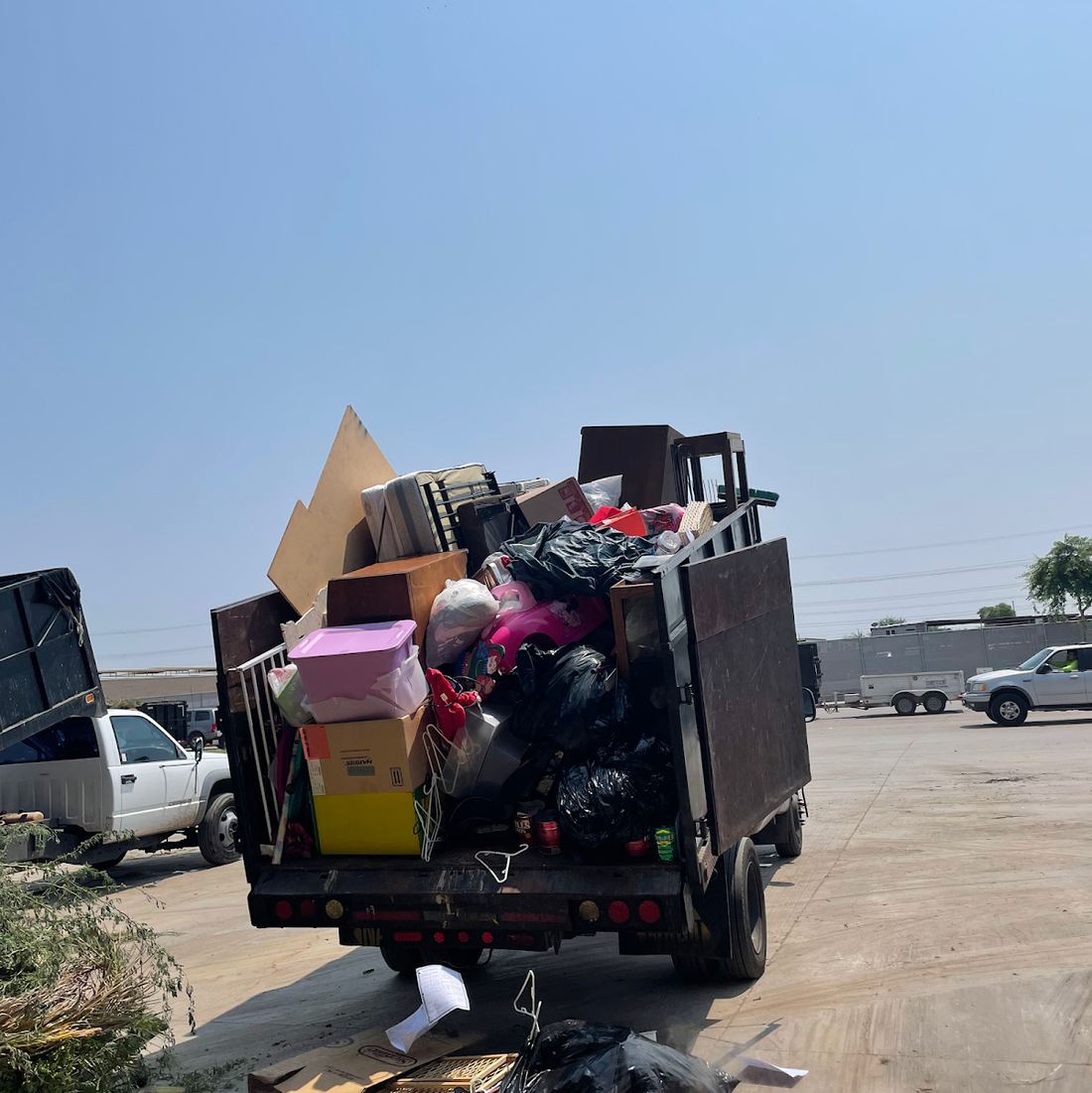 Benshines truck loaded high with boxes, bags and furniture