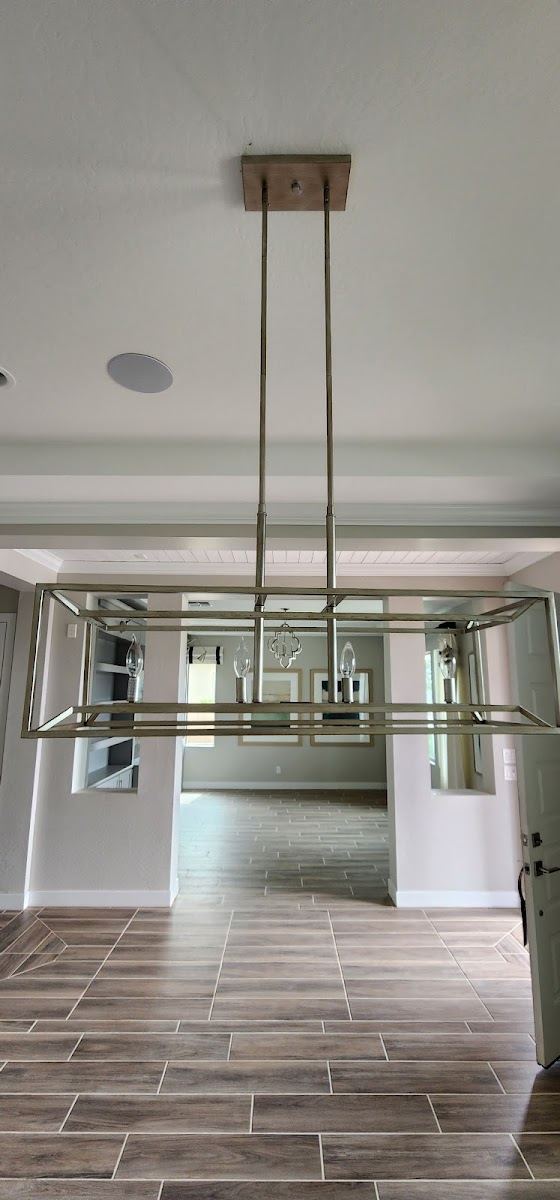 Hanging rectangular light fixture over a tile floor