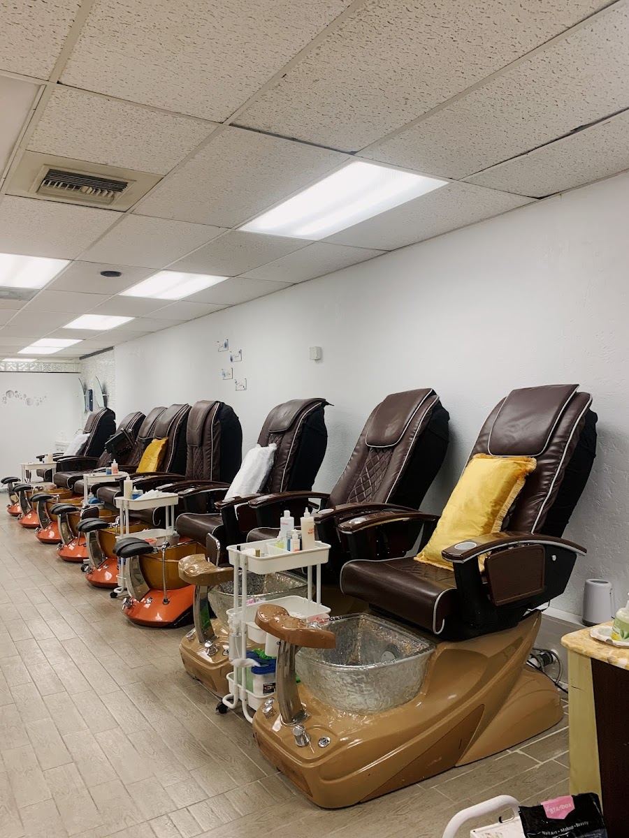 Row of pedicure spa chairs inside Bomb Nails
