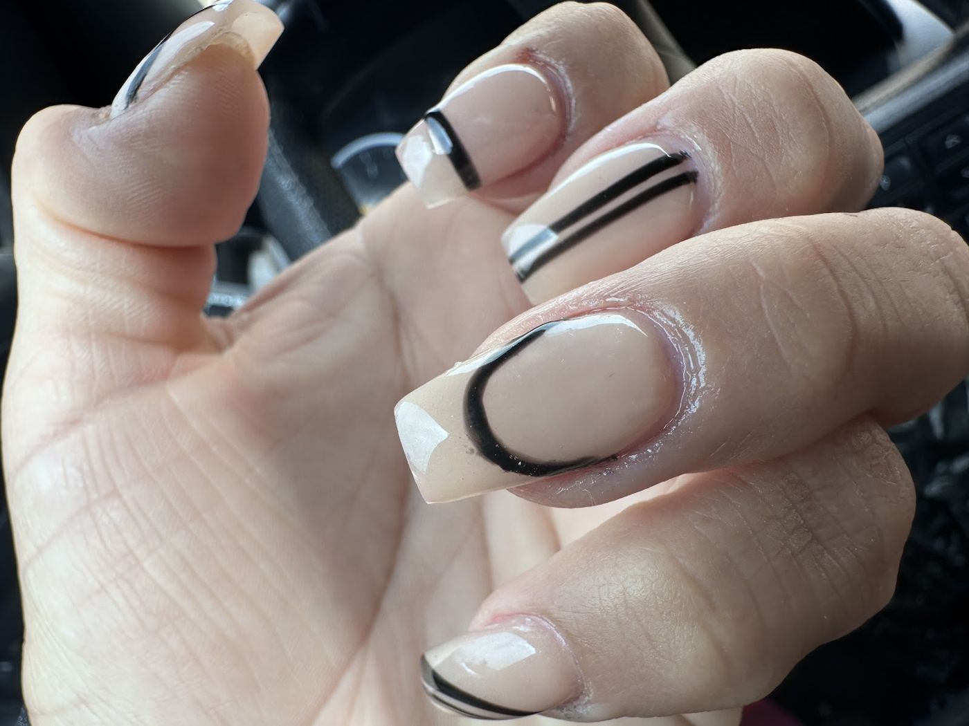 Nude square nails with black line art
