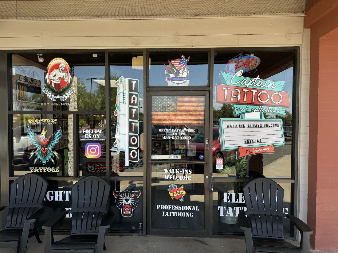 Captain Tattoo storefront on W Baseline Rd with walk-ins welcome signs in the windows