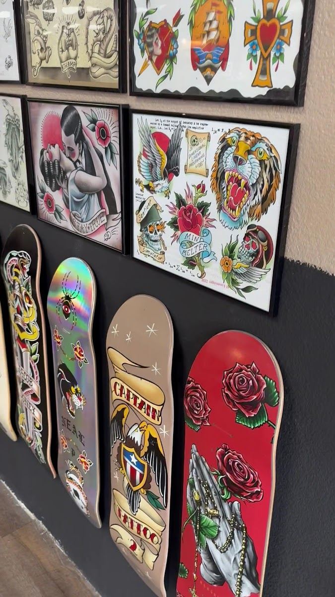 Traditional flash and painted skate decks on the shop wall