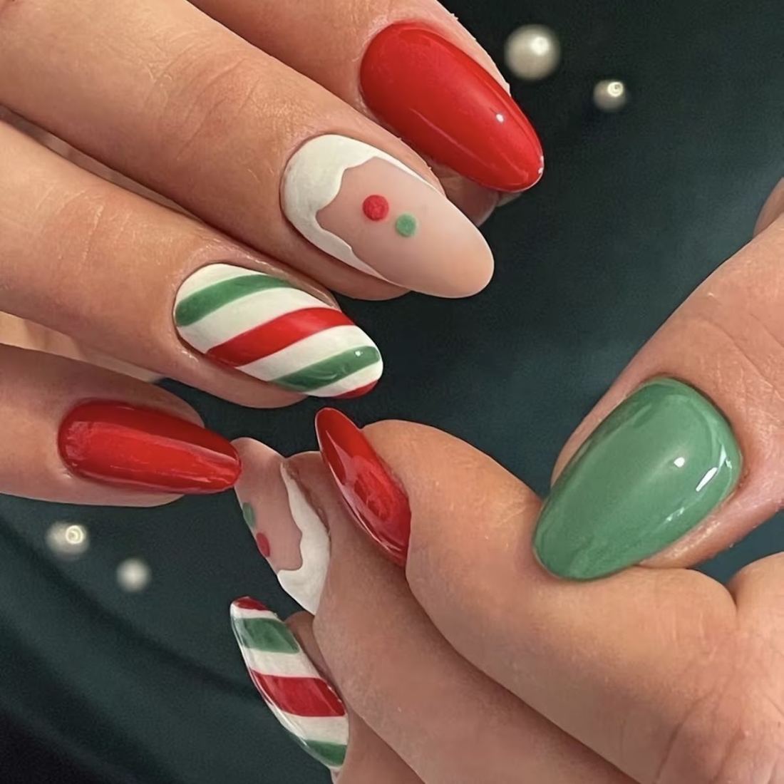 Holiday set with candy cane stripes, a gingerbread nail, red and sage green polish