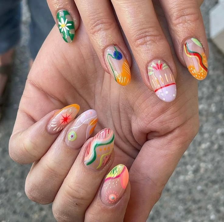 Ten nails each painted with a different hand-drawn design: swirls, flowers, starbursts and stripes in bright colors
