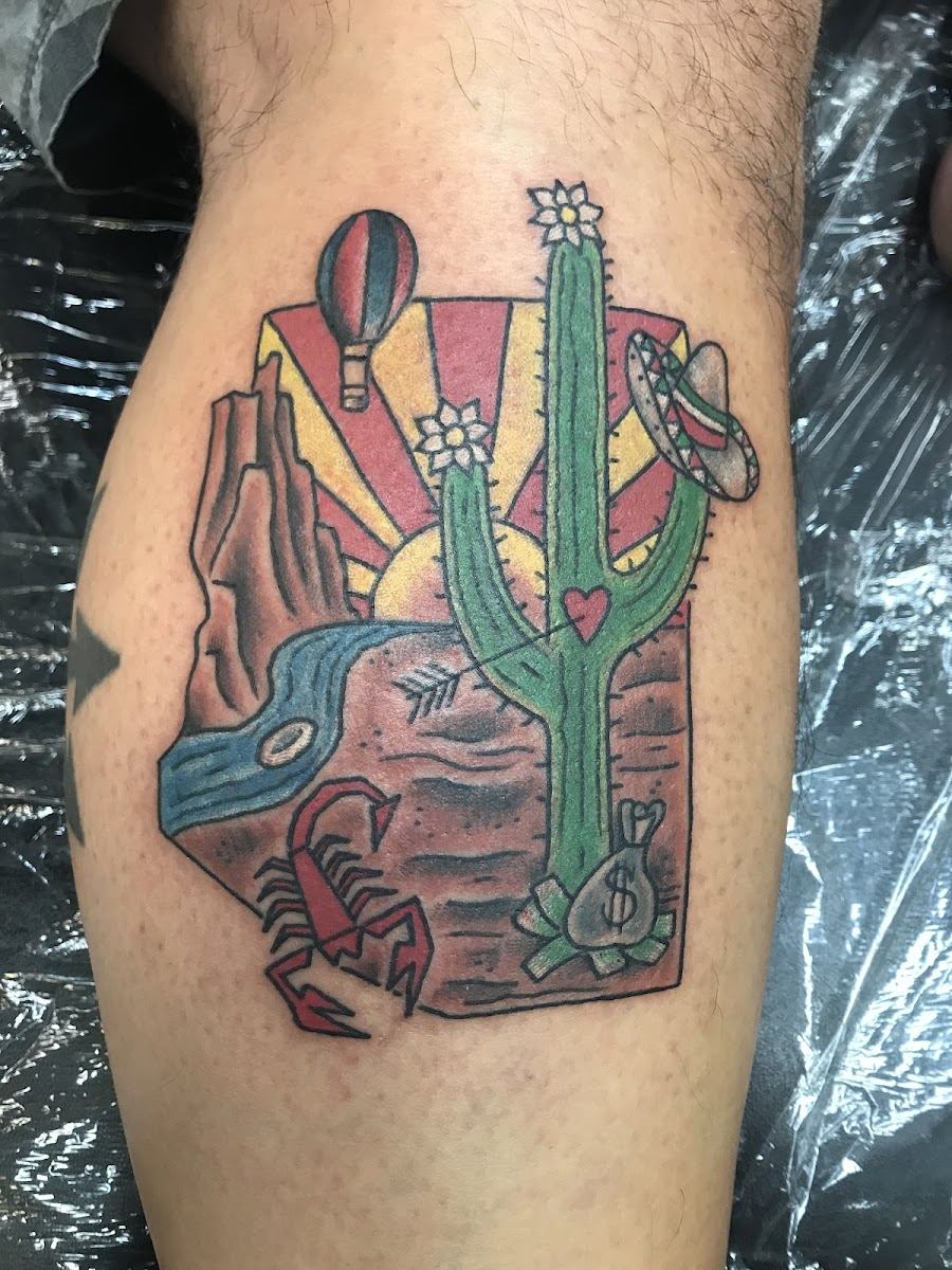 Arizona state outline tattoo with saguaro, sunset rays and hot air balloon