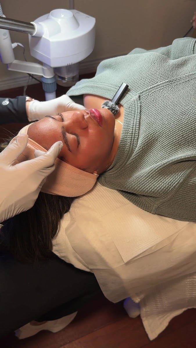 A client relaxing during a facial treatment at Dolce Lounge