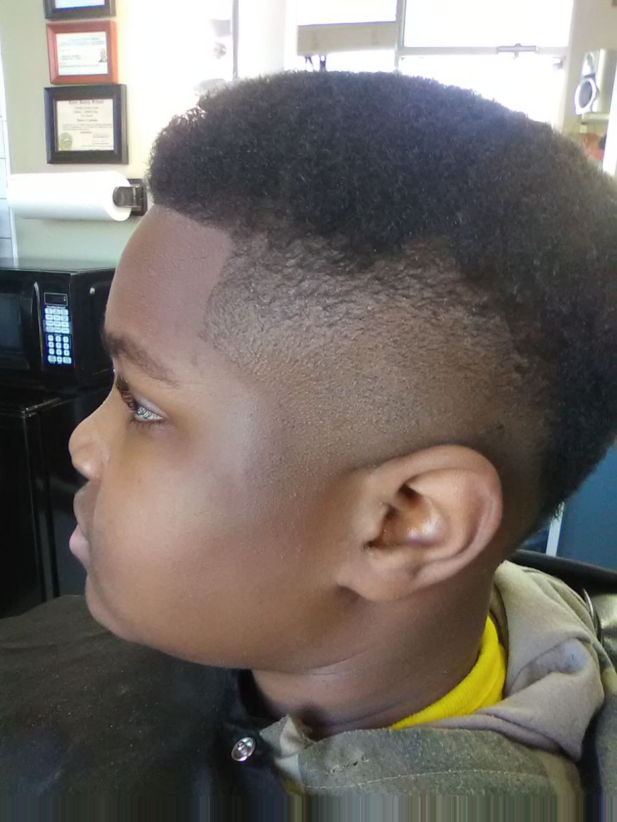 Boy with a high top fade, side profile