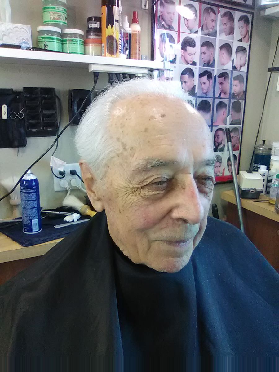Senior gentleman smiling after a trim