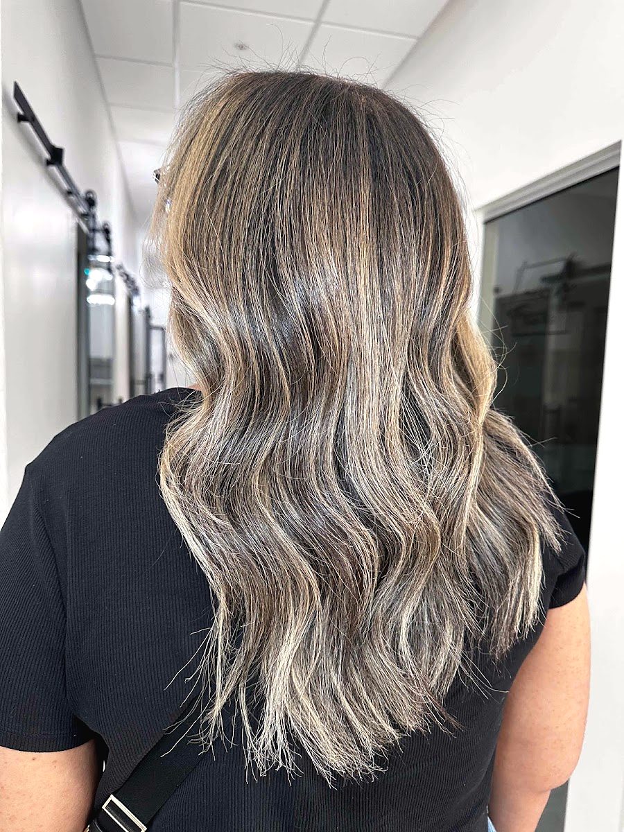 Back view of long hair in soft waves, brunette melting into beige blonde