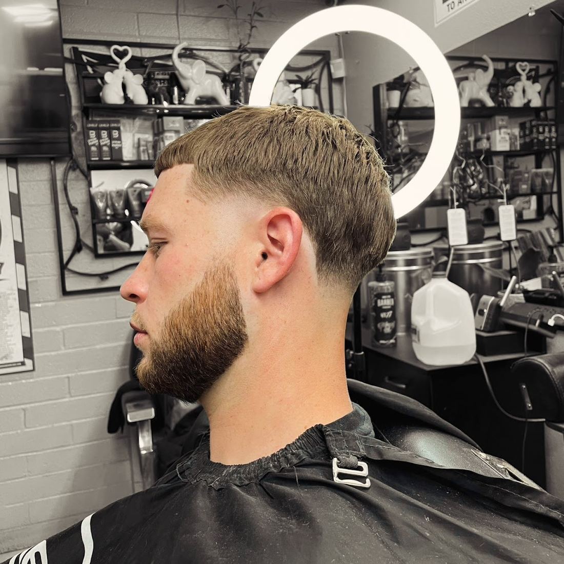 Textured crop with a skin fade and full beard, side profile