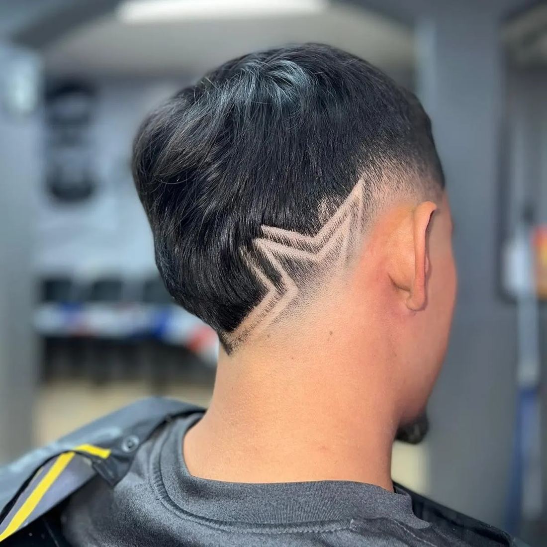 Star shape shaved into a fade, seen from behind