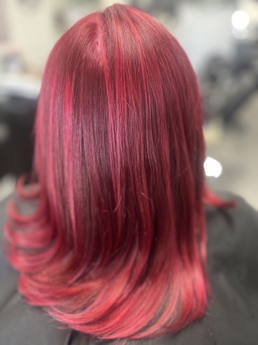 Shoulder length ruby red hair with bright red ends