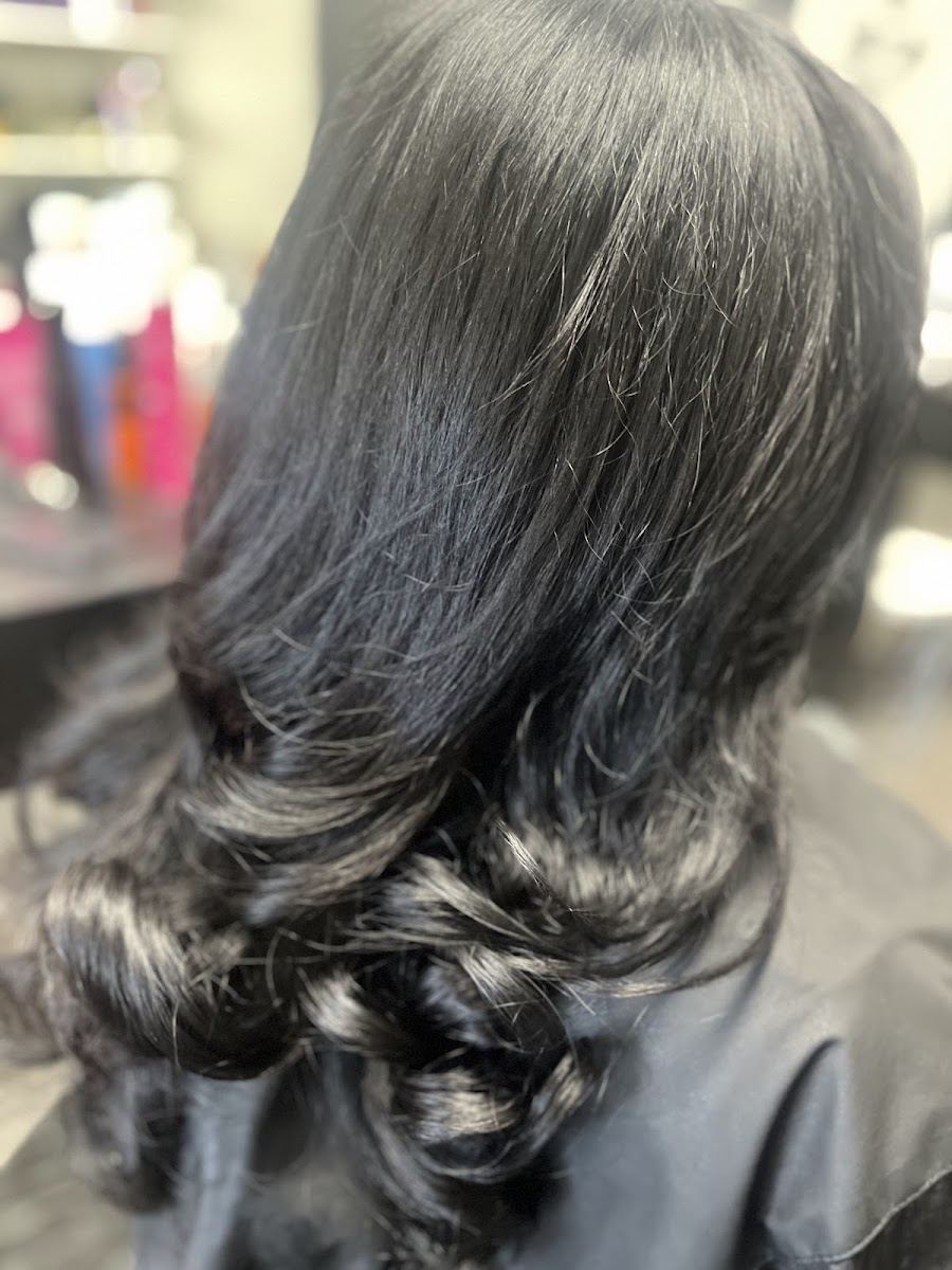 Glossy black hair with big soft curls