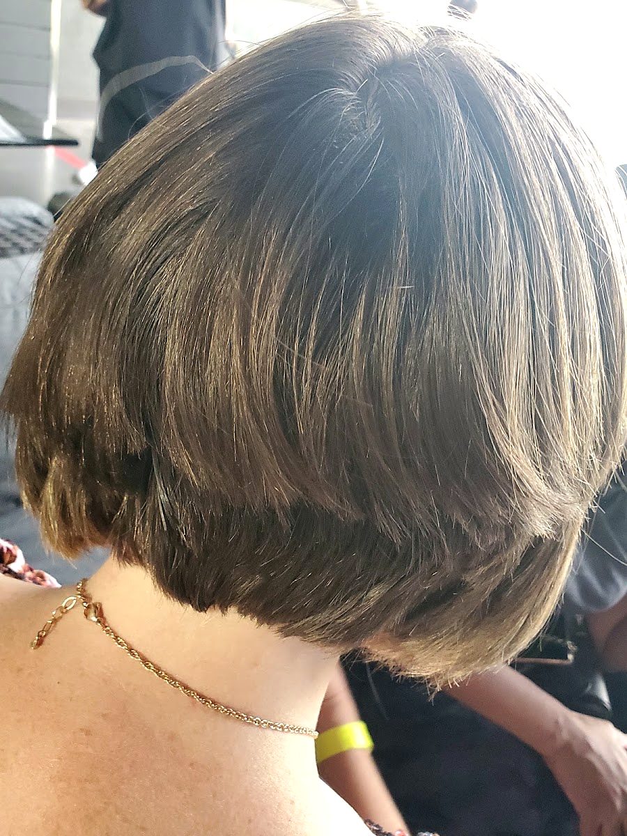 Back view of a short stacked bob in a soft brunette