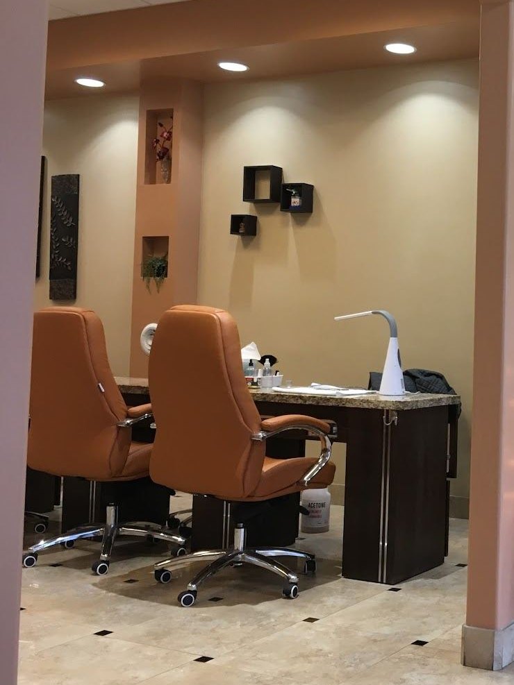 Manicure stations and chairs inside Furama Nails