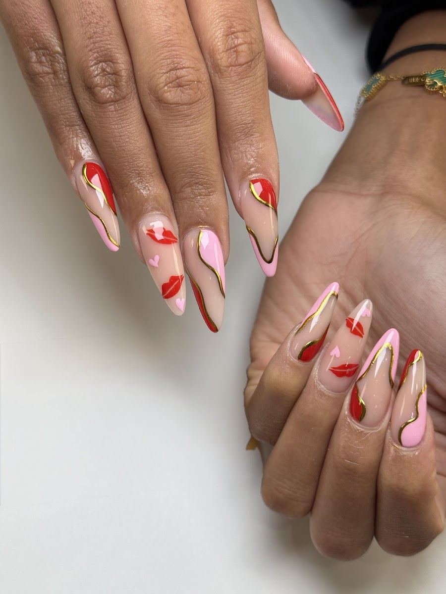 Nude almond nails with red and pink swirl art