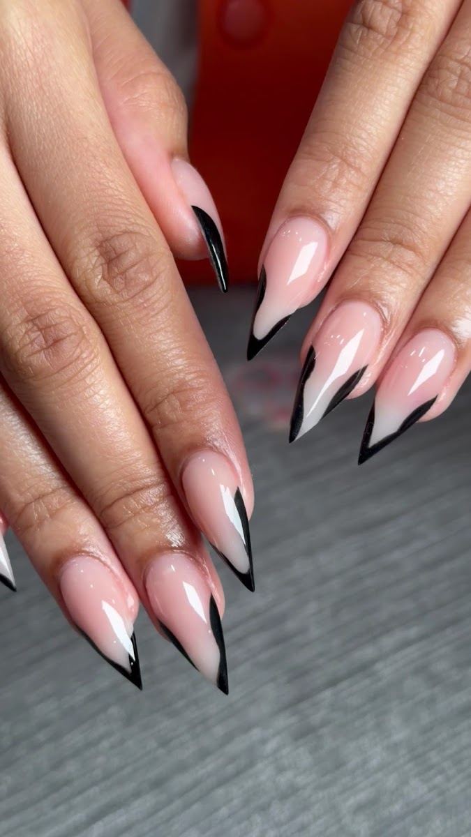 Nude stiletto nails with black V French tips