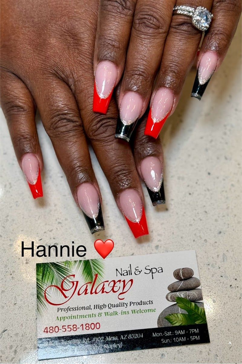 Red and black French tip nails beside a Galaxy Nail and Spa business card