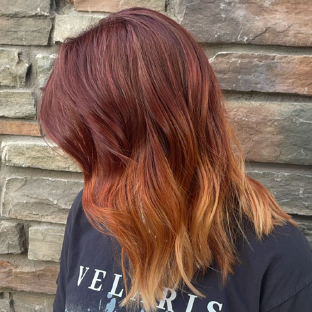 Deep red hair melting into copper ends