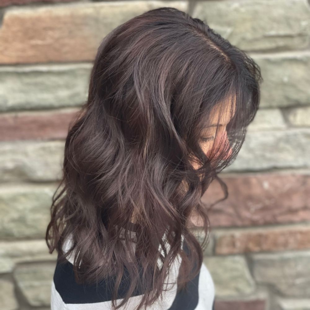 Deep brunette hair styled in loose waves