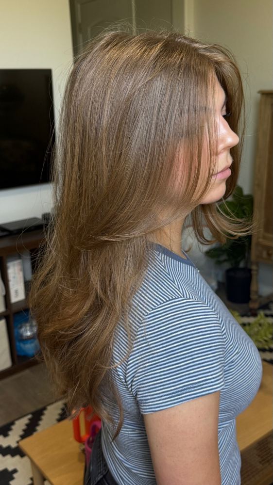Long layered light brown hair, side profile