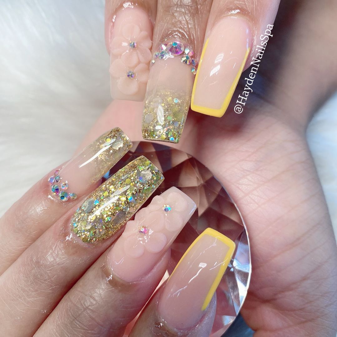 Nude coffin nails with gold glitter and crystal accent nails