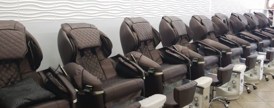 A row of brown leather massage pedicure chairs at Hayden Nails & Spa