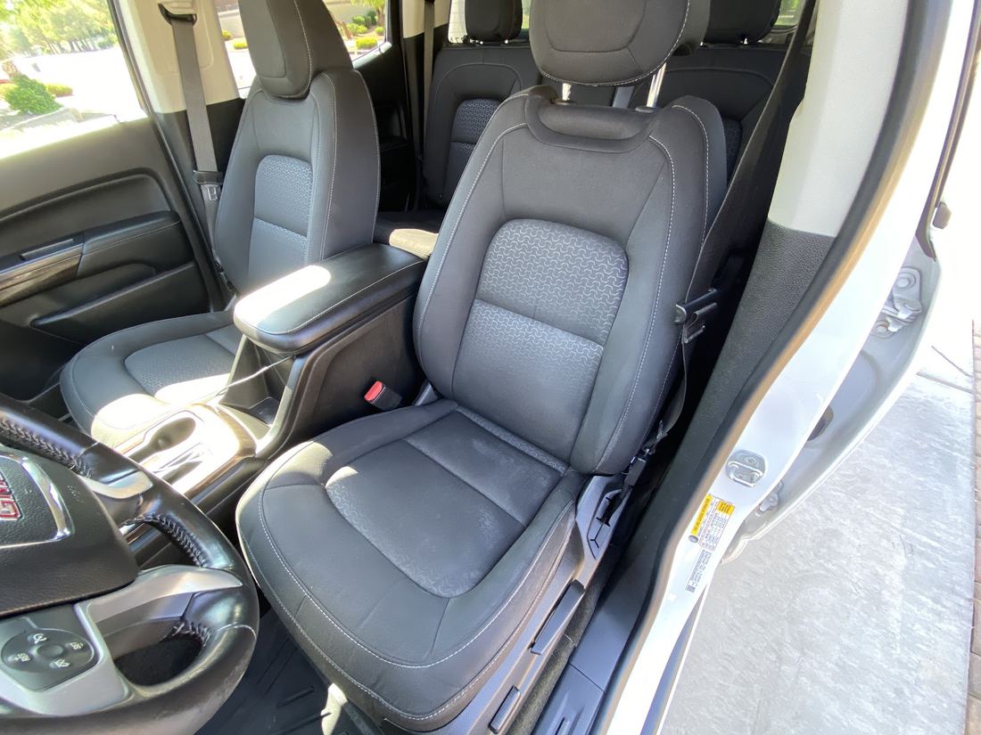 Gray cloth seats and center console after an interior detail