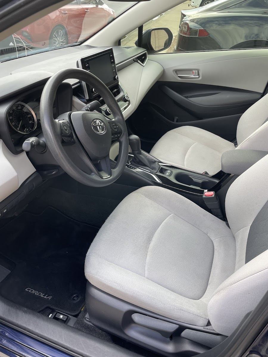Sedan interior with clean light gray seats and dash