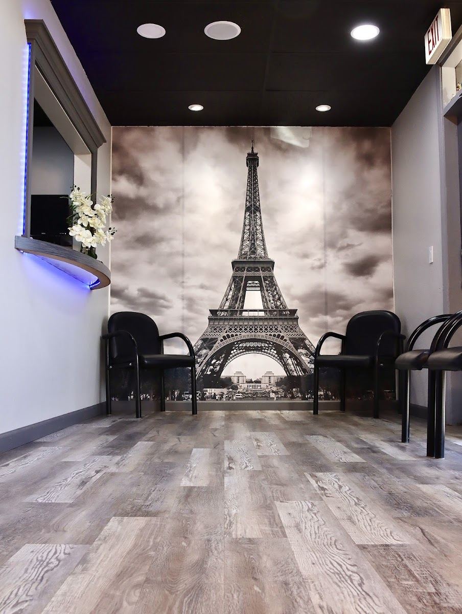 Waiting area with an Eiffel Tower mural