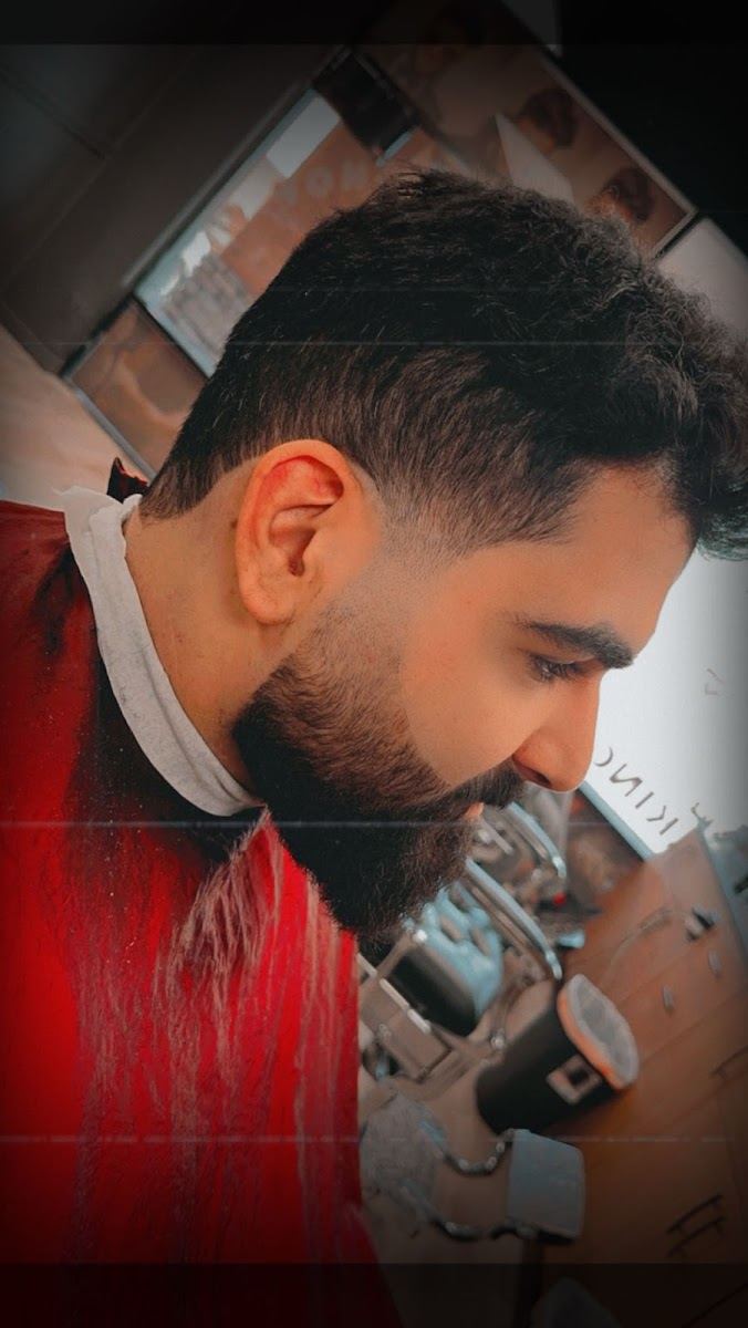 Client with a sharp lined beard and fade