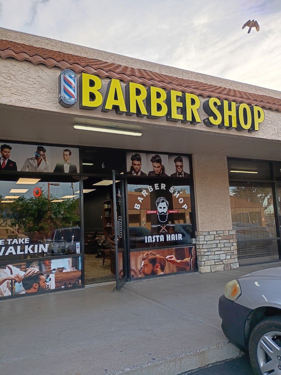 InstaHair storefront with yellow Barber Shop sign letters