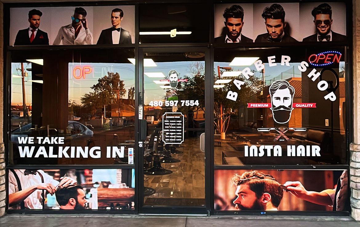 InstaHair storefront windows with a sign reading We take walking in