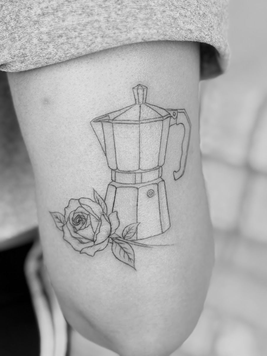 Fine line moka pot and rose tattoo on the back of an arm