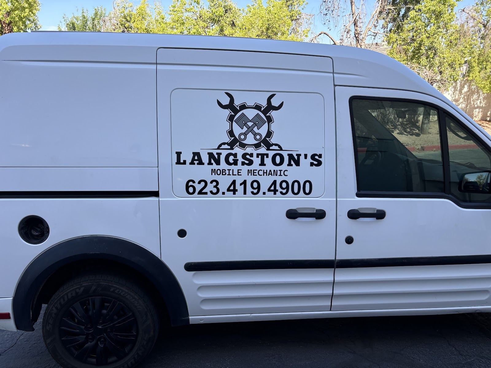 White Langston’s Mobile Mechanic service van with the phone number on the side