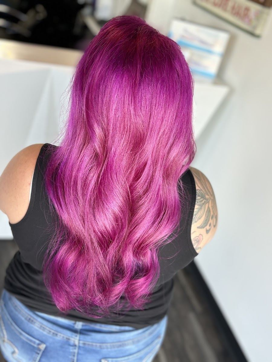 Long magenta and pink waves seen from behind