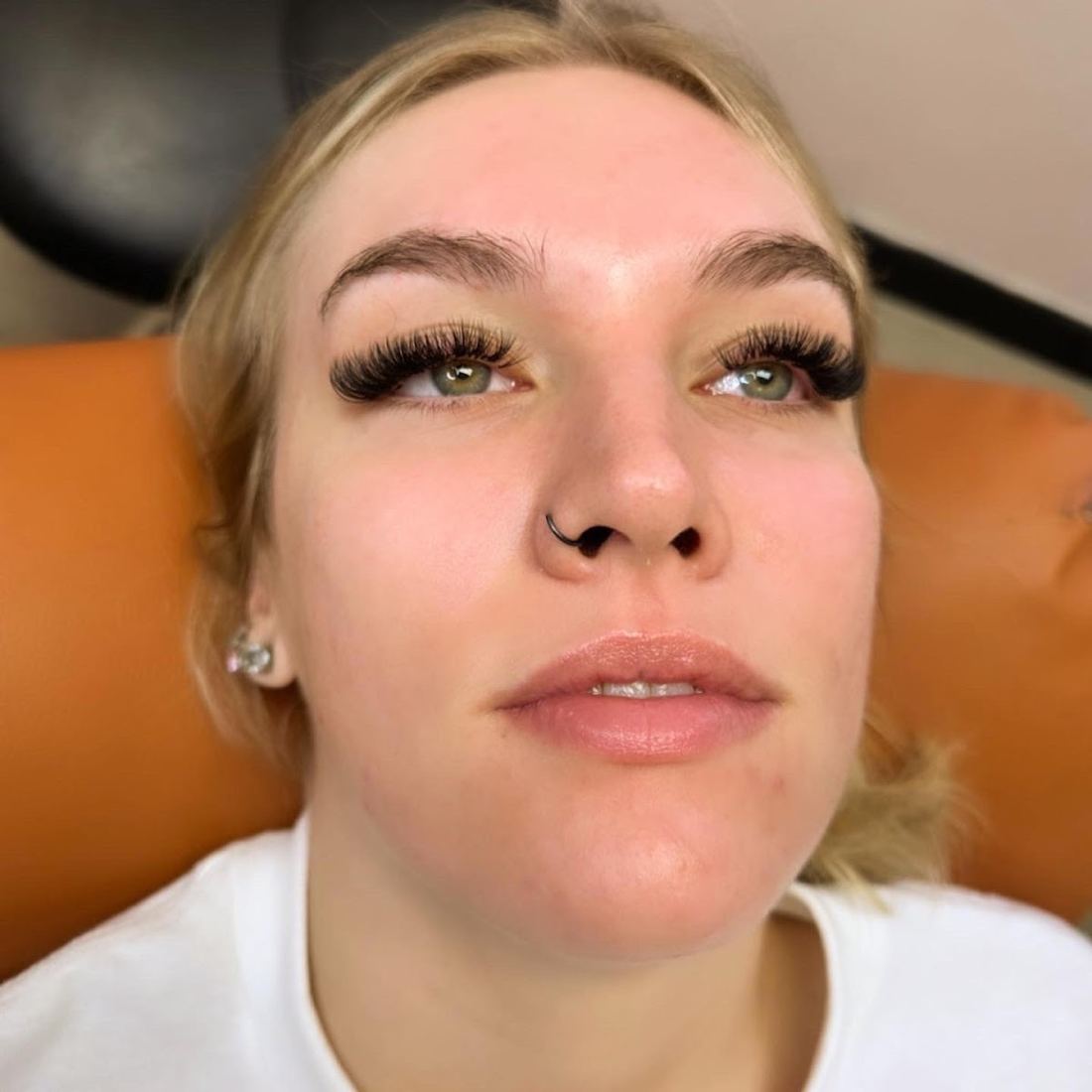 Client in the lash chair with a full, fluffy lash set