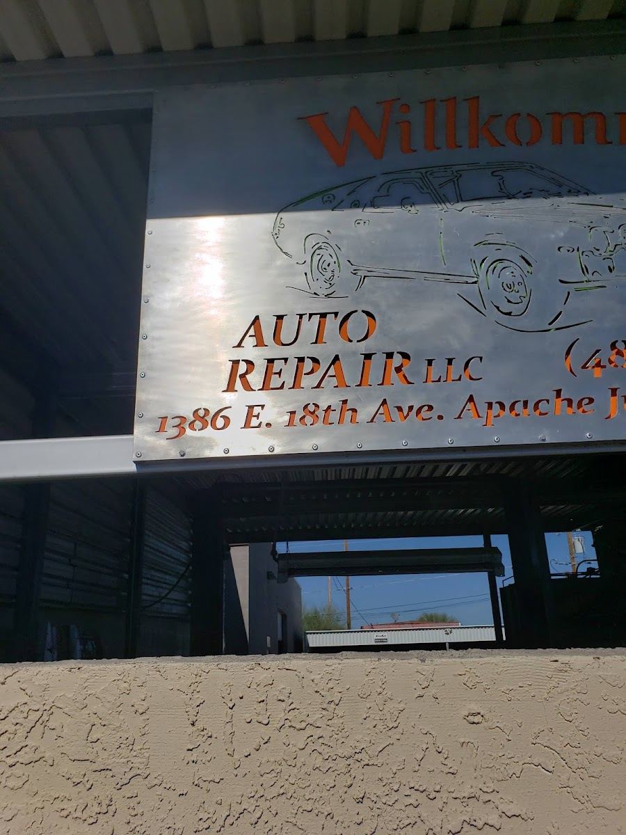 Brushed metal shop sign with copper lettering