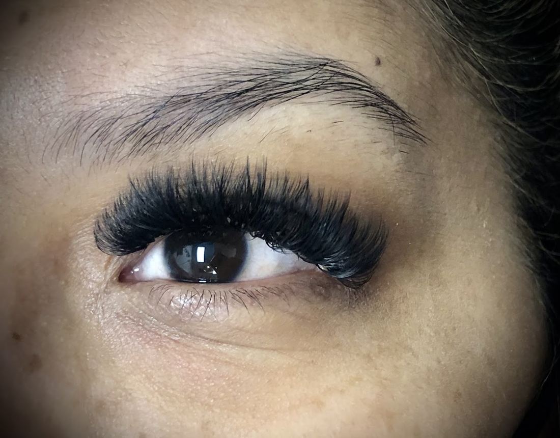 Volume lash extensions on a brown eye