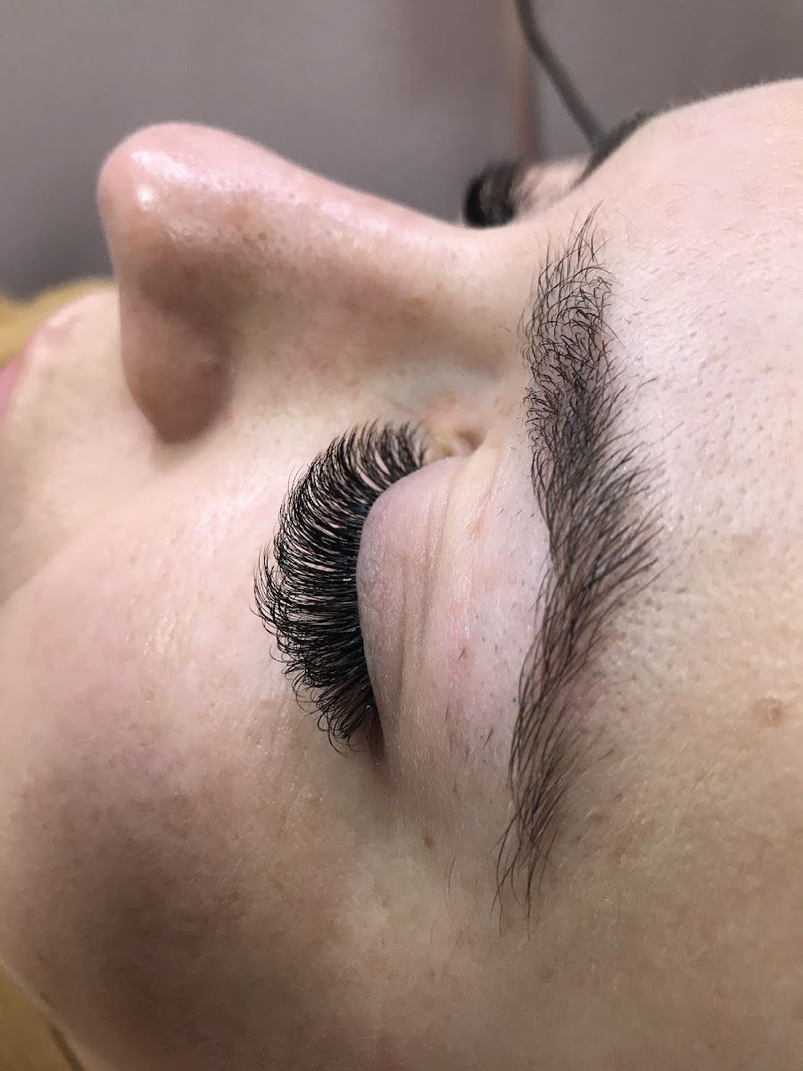 Side view of lash extensions and a filled brow