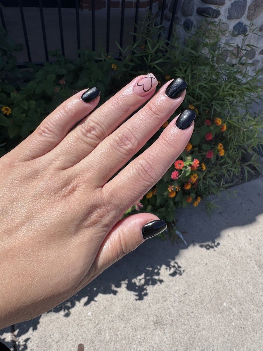Black almond nails with fine line art outdoors