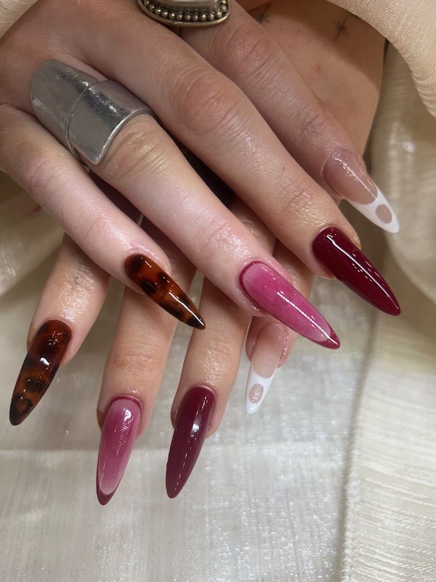 Long almond nails in wine, mauve and tortoiseshell with a clear heart French tip