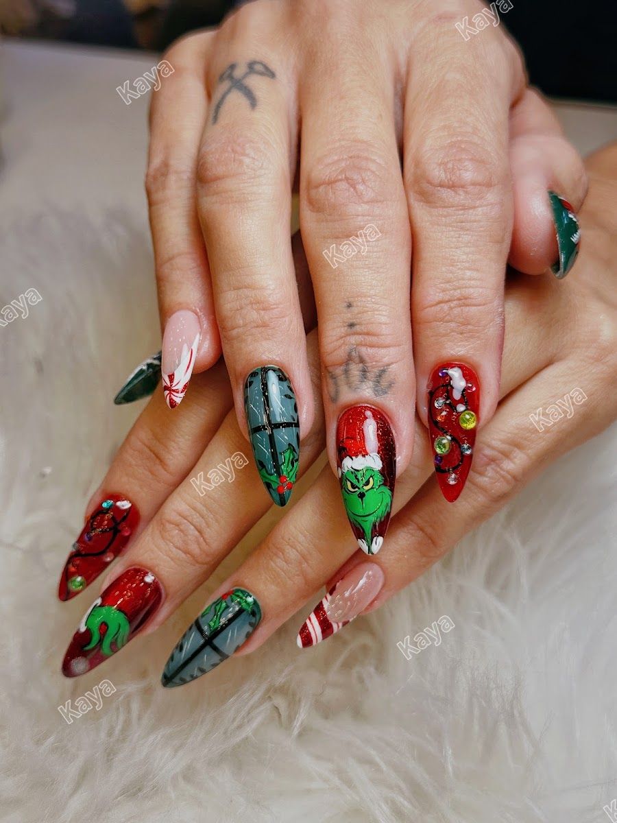 Long almond nails hand-painted with holiday character art