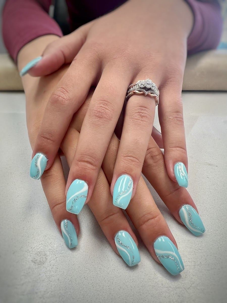Light aqua coffin nails with thin white swirl lines
