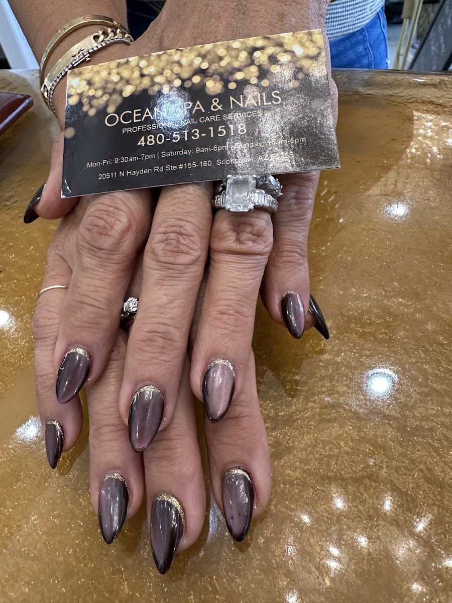 Long almond nails in a smoky chrome finish