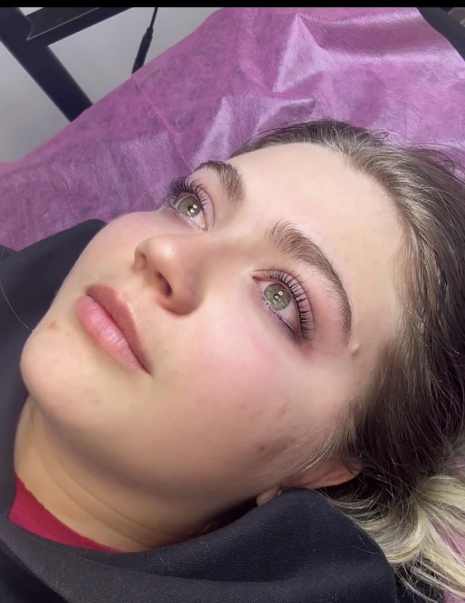 Client with freshly shaped brows and a lash lift