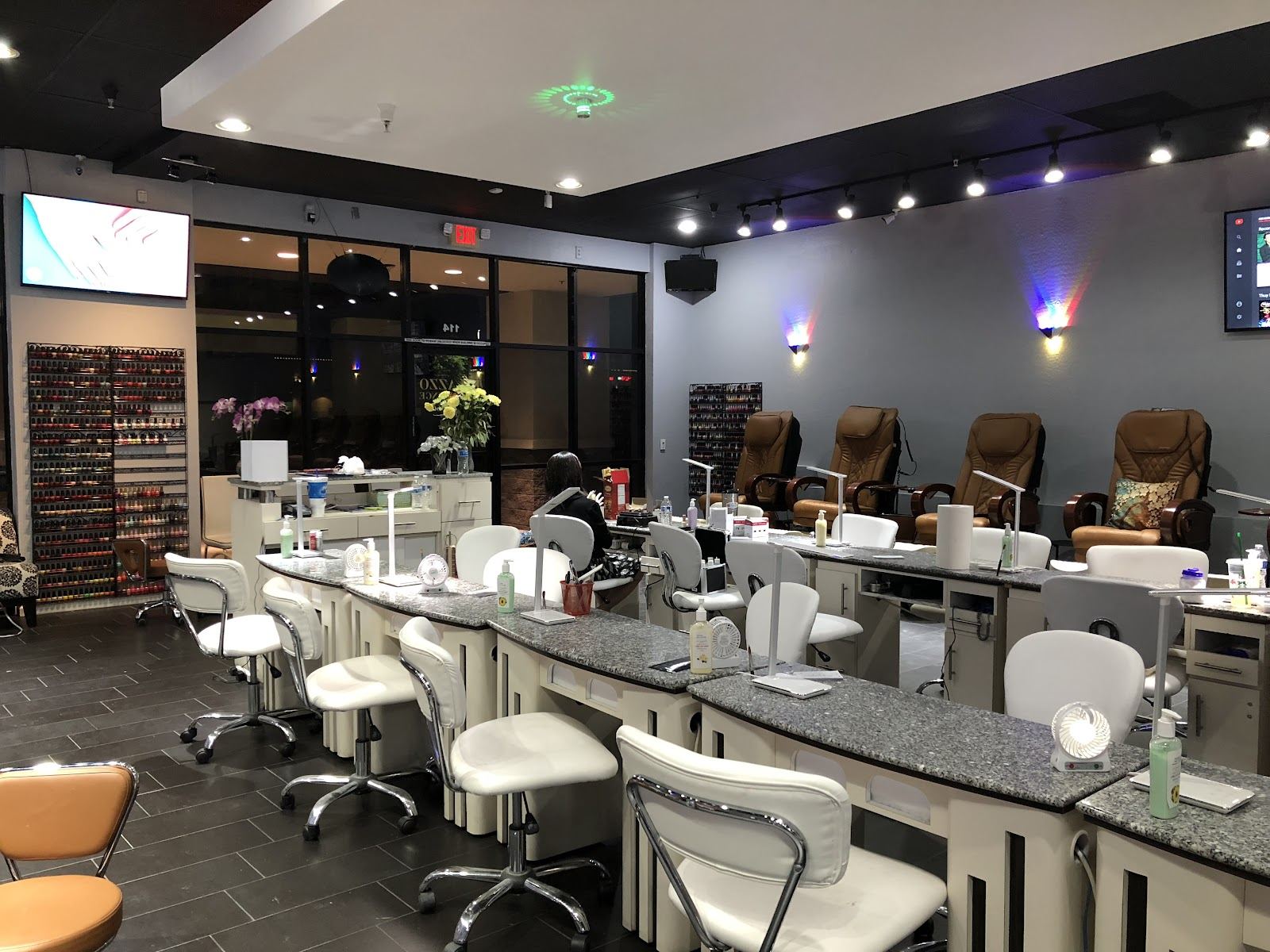 Inside Palazzo Nail Lounge: rows of manicure tables and pedicure chairs